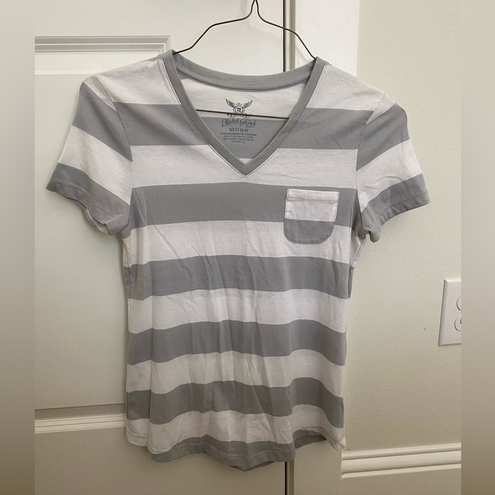 Gray and white striped t-shirt with a front pocket